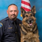 Photo of Sergeant Wilkey and retired K-9 Cash Photo of Sergeant Wilkey and retired K-9 Cash